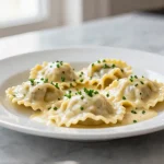 Delicious Gordon Ramsay Lobster Ravioli topped with fresh herbs